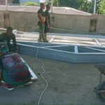Babinsa dan Anggota Koramil 1615-11/Aikmel Gotong Royong Bersihkan Lahan Pembangunan Solar Dryer Dome